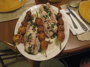 Grilled fillet of fresh caught striped bass dressed in an olive oil emulsion of lemon, garlic, wine, basil and capers, served with roasted new potatoes